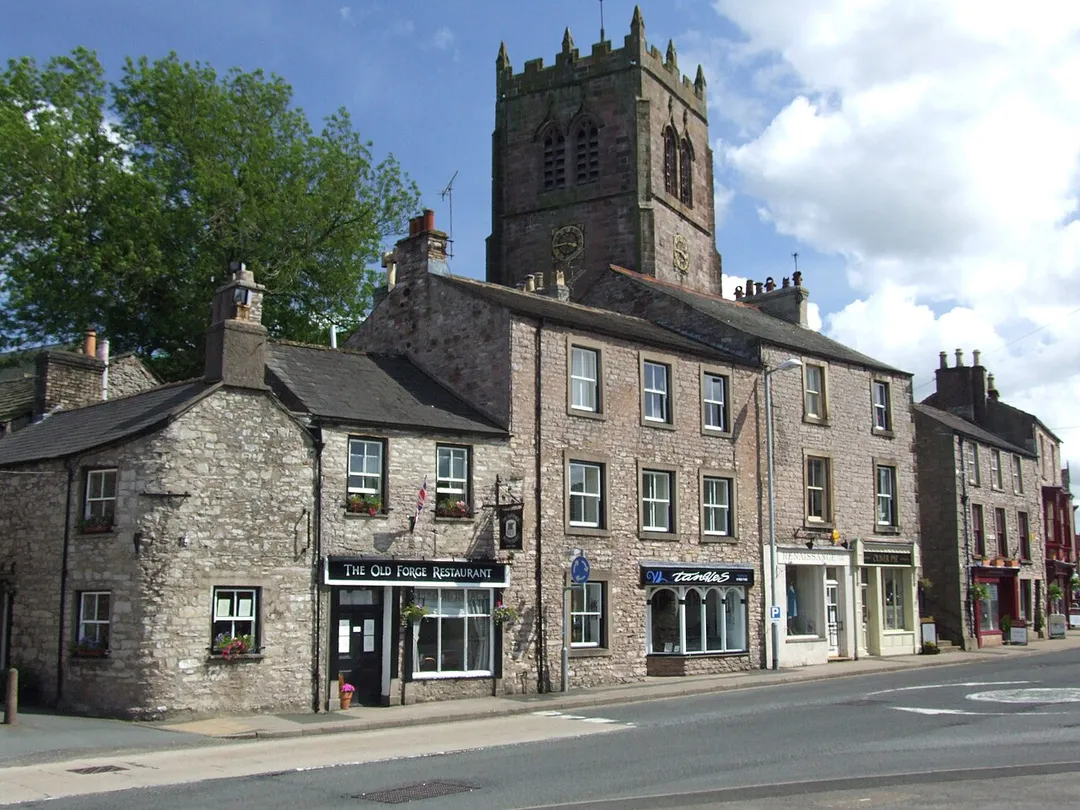 Kirkby Stephen: Off the Market Square stands the parish church which is shared between the Roman Catholics and the Anglicans.

A view over North Road and the Old Forge. Cropped.