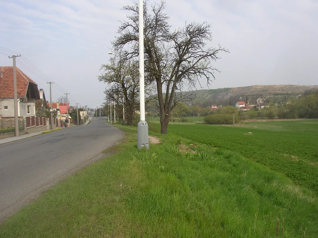 Vrapice, a suburb of Kladno city, Czech Republic. A view along Vrapická street towards east with Buštěhrad slag heap on the right horizon.