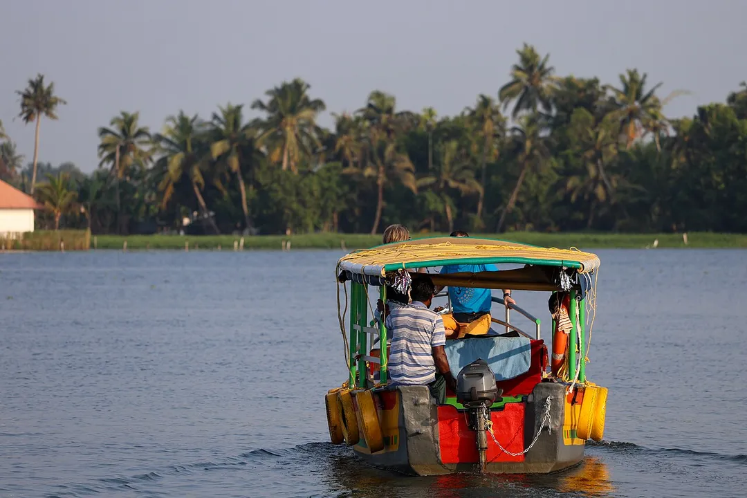 Tourists travelling in a boat in Alappuzha backwaters