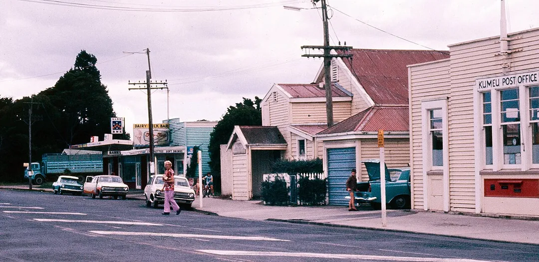 The main street in Kumeu, showing the Post Office, the local dairy and the BNZ Bank. Auckland Libraries Heritage Collections 1727-128