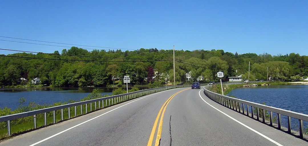 Looking north along NY 311 crossing Lake Carmel just north of its southern terminus at NY 52.