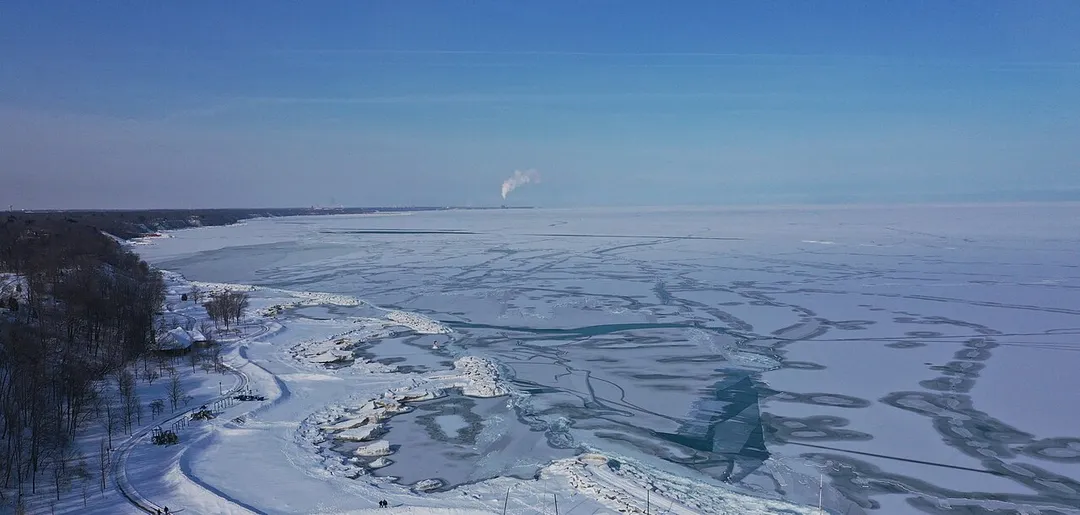 2019 Late January Lake Michigan Freezes viewed from the shore of Lake Forrest with the Forrest Park in the foreground. The temperature had plunged to negatives Fahrenheit for nearly 48 hours.