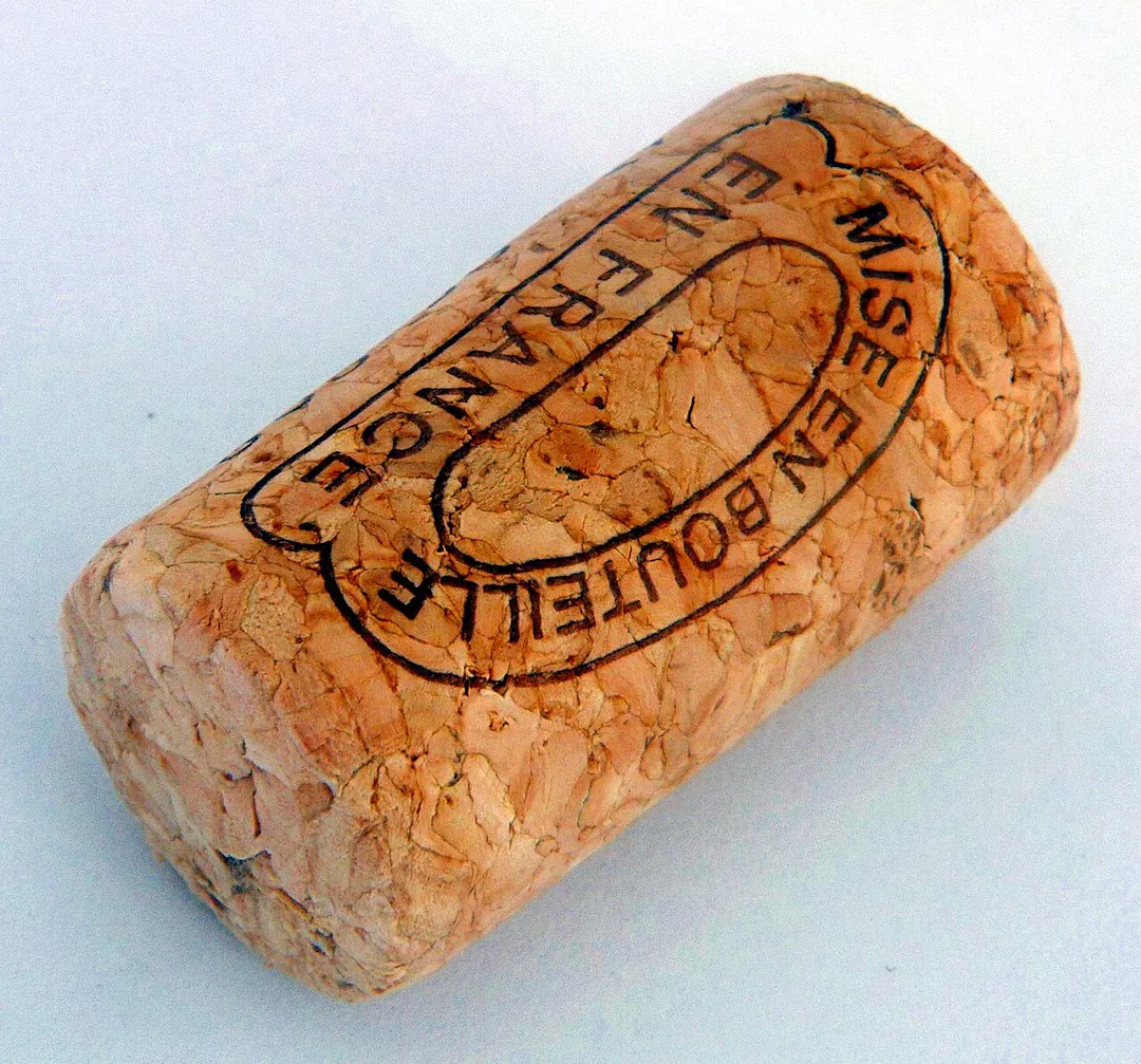 The cork of a wine bottle (made from cork); says "bottled in France"