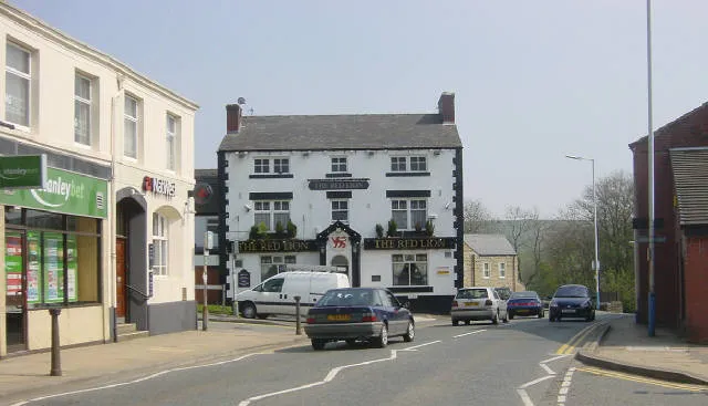 Lees village centre, in Greater Manchester, England.
Looking eastwards along the A669 at Lees, near Oldham, towards County End, with the Red Lion pub on the corner.