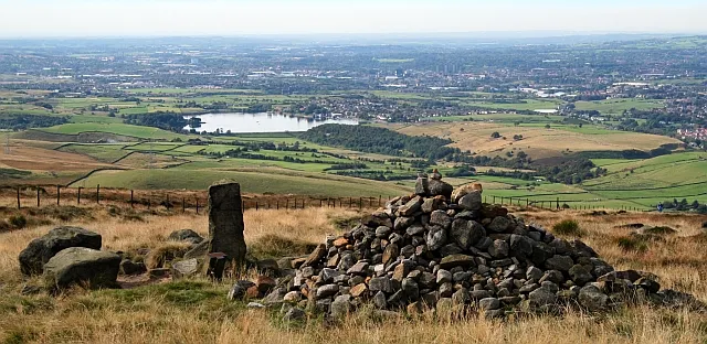 The Aiggin Stone and Cairn on Blackstone Edge Moor, overlooking Rochdale and Littleborough in Greater Manchester, England.

Hollingworth Lake and Country Park can be seen south of Littleborough.