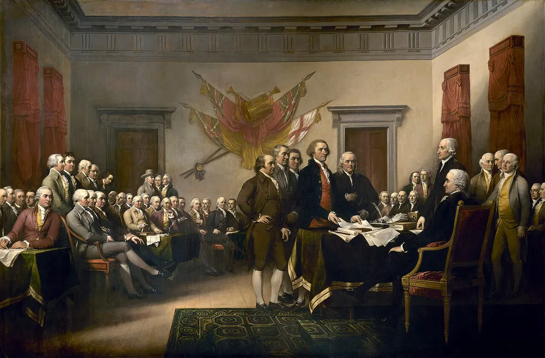 John Trumbull's painting, Declaration of Independence, depicting the five-man drafting committee of the Declaration of Independence presenting their work to the Congress. The painting can be found on the back of the U.S. $2 bill. The original hangs in the US Capitol rotunda. It does not represent a real ceremony; the characters portrayed were never in the same room at the same time.