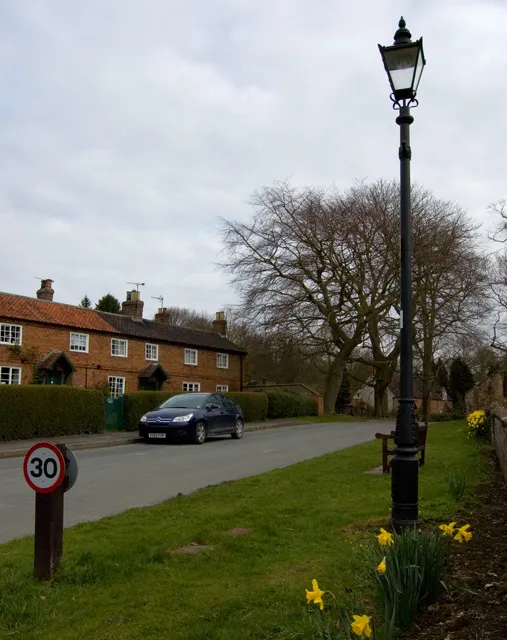 Low Street, Londesborough, East Riding of Yorkshire, England.Londesborough remains an estate village. The estate was bought by Lord Albert Denison in 1850. Before this, Londesborough had passed down through the Clifford and Boyle families. In the 17th century, Richard Boyle employed the architect Robert Hooke to build a 'Wren-style country house'. He also built new stables and gardens and made improvements to the village, including a hospital for 12 poor people of the parish - this still exists (1231297). His great-grandson (also Richard) rebuilt Londesborough in the 1730s. 
The estates became neglected in the late 18th century after they came into the possession of the dukes of Devonshire. The sixth duke of Devonshire demolished the house in 1818, and built a new one in 1839. He sold this, along with the estate, in 1845 to railway entrepreneur George Hudson. Following Hudson's disgrace the estate remained in the Denison family until 1923. Since 1935 it has been owned by the Ashwin family.
