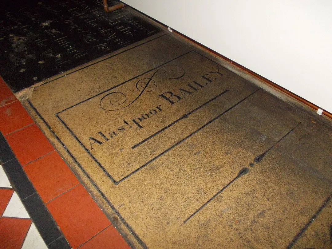 Dr Bailey's inscribed headstone, in Long Sutton Church. The doctor was murdered 1795, and the stone reads 'Alas poor Bailey'.
