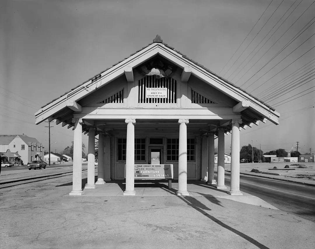 The Lynwood Pacific Electric Railway Depot (southeast side elevation) — a Pacific Electric Railway depot in Lynwood, California. 
The 1917 depot is on the National Register of Historic Places in Los Angeles County, California. In a "Bernard Maybeck style" − though it  was not designed by him.
Image (1980): HABS−Historic American Buildings Survey in Los Angeles, California.
