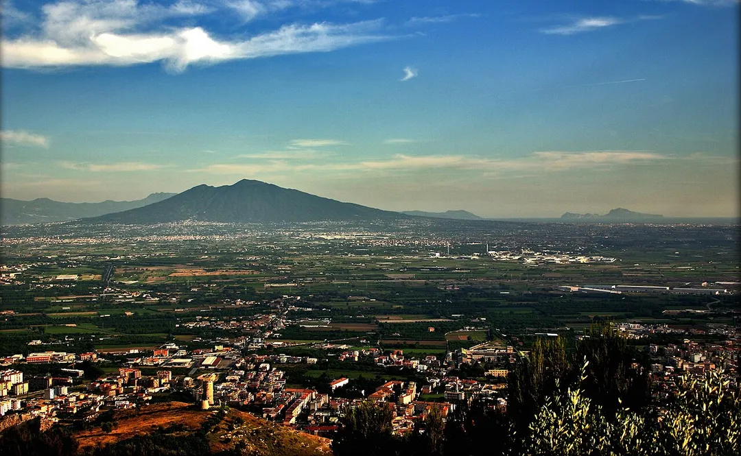 Viewpoint of Mount Vesuvius and Capri island from a hill of Maddaloni. Maddaloni is visible in the foreground.