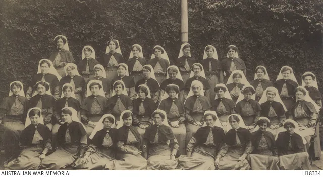 Outdoor group portrait of nurses of No 2 Australian General Hospital who sailed from Sydney on 28 November 1914 aboard HMAT Kyarra. 
Identified in the back row from left to right: 

Sisters Constance Adel Stone from Orange, NSW;
Emily Broughton Gwynne from Ryde, NSW;
Lily Campbell from Richmond River, NSW;
Ida Mary Garven from Clarence River, NSW;
Mary Theresa Martin from Newcastle, NSW;
Sarah Varcoe from Gunbar, NSW;
Gwladys Gwynne Llewellyn from Ryde, NSW;
and Nelly Francis Hill from Epping, NSW.
Second row from left to right: 

Sisters Janet Sorley from Sydney, NSW;
Grace Thompson from Strathfield, NSW;
Lydia Kate King from Orange, NSW;
Bessie Ada Todhunter from Summer Hill NSW;
Ursula Mary Carter from Darling Point, NSW;
Daisy Donaldson Richmond from West Goulburn, NSW;
Muriel Wakeford from Wollongong, NSW;
Myra Septima Wyse from Randwick, NSW:
Minnie Kate Porter from Woollahra, NSW;
Sophie Durham from Sydney;
and Sylvia Mabel Weigall from Darling Point.
Third row from left to right: 

Sisters Margaret Woods from Moree, NSW;
Eva Estelle Holloway from Ashfield, NSW;
Mary Nash from Mosman, NSW;
Nellie Constance Morrice from Sutton Forrest, NSW;
Annie Bertha Parry from Picton, NSW;
Florence Ethel Spalding from Manly, NSW;
Phyllis Mary Boissier from Mascot, NSW;
Elizabeth Mattie Chisholm from Goulburn, NSW;
Flora Robertson from Bellevue Hill, NSW;
Wilhelmina Fillans from Arncliffe, NSW;
Amy Ennis from Chatswood, NSW;
and Winifred Mary Tait from Carlington, NSW.
Front row from left to right:

Sisters Bessie Crago from Yass, NSW;
Maud Margaret McNulty from Sydney (later awarded Royal Red Cross Second Class);
Elizabeth Kearey from Randwick;
Eileen May Coleman from Lewisham, NSW;
Edith Annie Foster from Vauclause, NSW;
Clarice Molyneux Dickson from Grose Vale, NSW;
Dorothy Grendoline Cawood from Parramatta, NSW;
Annie Isabelle Coombes from Artarmon, NSW;
and Annie Georgina Farquhar from Mosman.