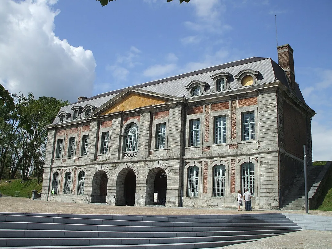 Mons's gate to Maubeuge in department Nord in France.  Built under Louis XIV of France by Sébastien Le Prestre de Vauban in 1682 to shelter a guardroom, housing and cells. The door is the last one of three doors of the surrounding wall of the city. Indeed the Door of France was destroyed in 1958 the door of Bavay is destroyed in 1952. it is built brick-built, blue stone and stoneware and possesses a drawbridge. it is classified as "Historic Monument" since 1924. It is the Tourist Information Office.