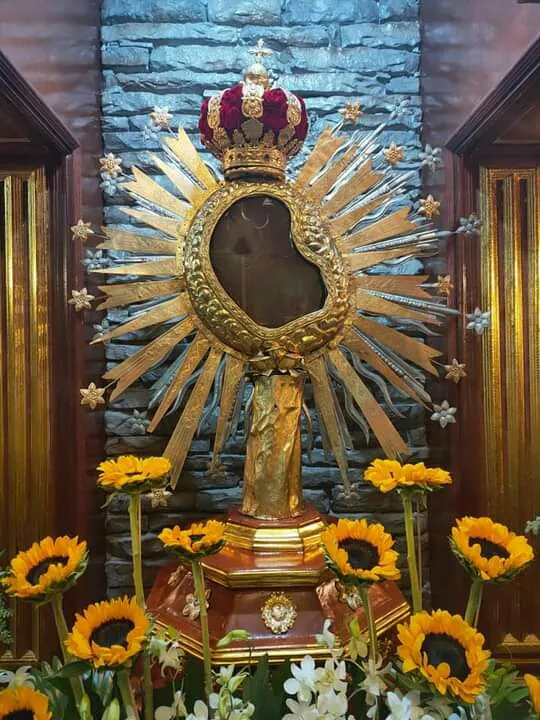 Our Lady of Maulawin (Spanish: Nuestra Señora de Maulawin, Filipino: Mahal na Birhen ng Maulawin), also known as the Virgin of Maulawin (Filipino: Birhen ng Maulawin), is a title of Mary, mother of Jesus, a Marian image and icon venerated in the Philippine Independent Church, also known as the Aglipayan Church. The town of Santa Cruz in the province of Laguna considers her as its patroness.