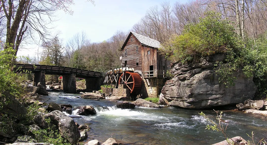 The Glade Creek Grist Mill, an iconic West Virginia attraction in Babcock State Park, WV, USA.
This semi-panorama was assembled from six separate parts, each taken with the same aperture and shutter settings for maximum compatibility. I used Paint Shop Pro 8, my graphic tablet, and my favorite method of erasing the layers into each other for assembly. The EXIF tag is a mockup from the bottom central picture, but most of the info should be correct, except for the image size.