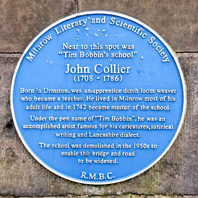 The blue plaque commemorating Milnrow's John Collier. This plaque is situated on Milnrow Bridge, in Milnrow, Greater Manchester.