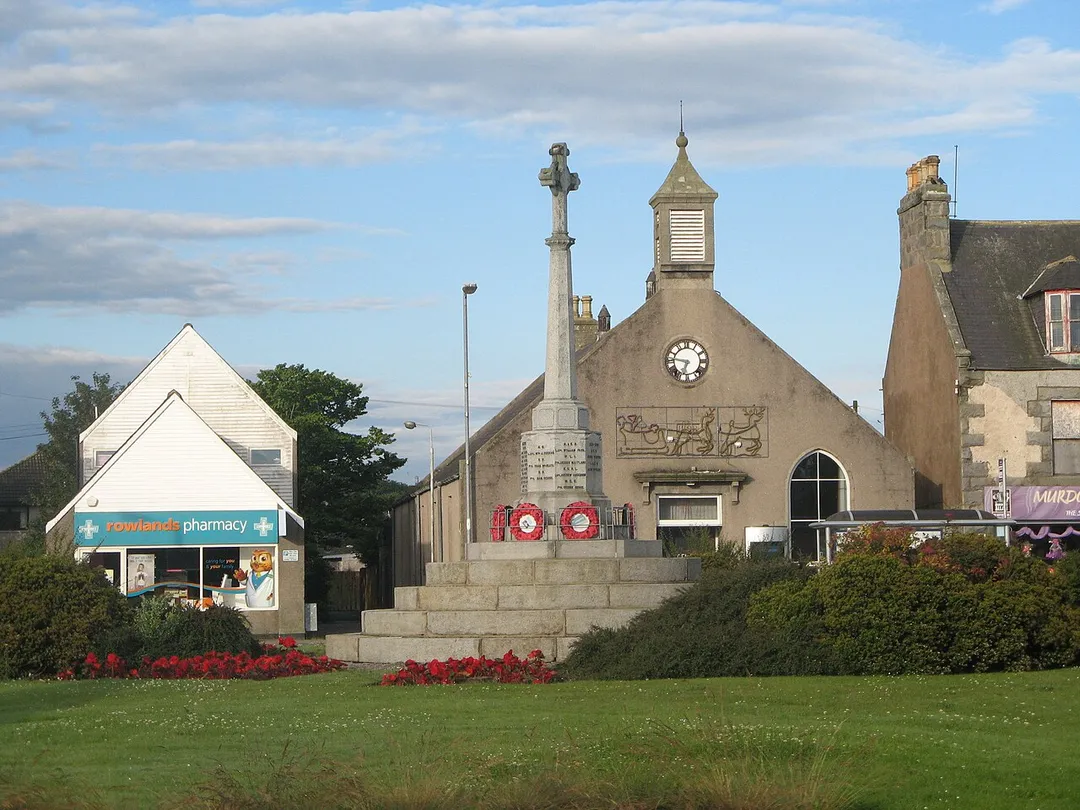 monument in the centre of the roundabout where the A952 (Aberdeen-Fraserburgh) intersects the A950 (Peterhead-New Pitsligo) roads