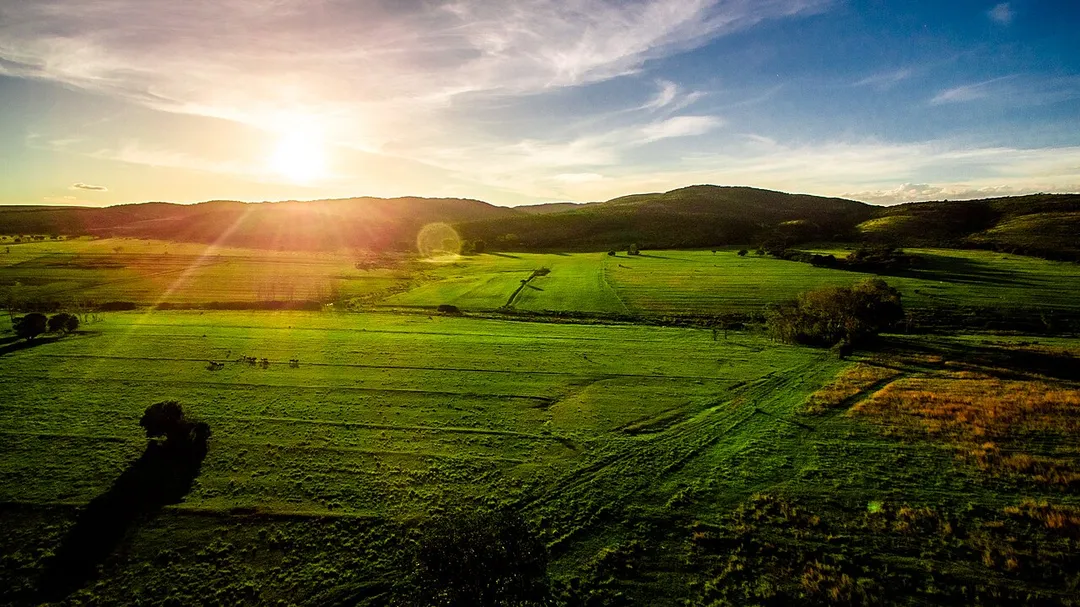 Sundown over one of the many beautiful mountain ranges found in Limpopo, South Africa. The valley in question is that of the Sand River, with a spur of the southern Waterberg in the background. Limpopo is known for its vast bushveld and wildlife reserves and if you look closely you will see some cattle grazing freely.