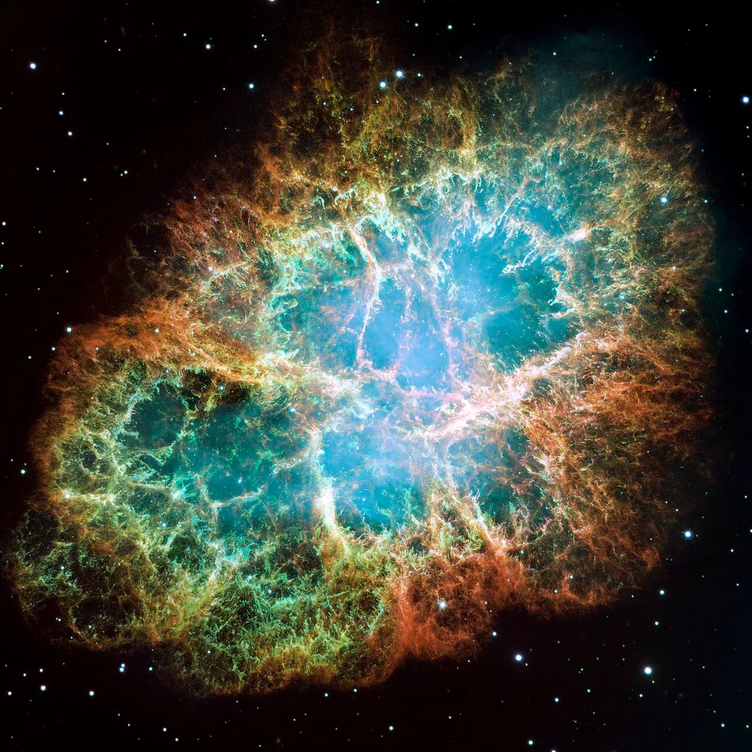 This is a mosaic image, one of the largest ever taken by NASA's Hubble Space Telescope, of the Crab Nebula, a six-light-year-wide expanding remnant of a star's supernova explosion. Japanese and Chinese astronomers recorded this violent event in 1054 CE.
The orange filaments are the tattered remains of the star and consist mostly of hydrogen. The rapidly spinning neutron star embedded in the center of the nebula is the dynamo powering the nebula's eerie interior bluish glow. The blue light comes from electrons whirling at nearly the speed of light around magnetic field lines from the neutron star. The neutron star, like a lighthouse, ejects twin beams of radiation that appear to pulse 30 times a second due to the neutron star's rotation. A neutron star is the crushed ultra-dense core of the exploded star.
The Crab Nebula derived its name from its appearance in a drawing made by Irish astronomer Lord Rosse in 1844, using a 36-inch telescope. When viewed by Hubble, as well as by large ground-based telescopes such as the European Southern Observatory's Very Large Telescope, the Crab Nebula takes on a more detailed appearance that yields clues into the spectacular demise of a star, 6,500 light-years away.

The newly composed image was assembled from 24 individual Wide Field and Planetary Camera 2 exposures taken in October 1999, January 2000, and December 2000. The colors in the image indicate the different elements that were expelled during the explosion. Blue in the filaments in the outer part of the nebula represents neutral oxygen, green is singly-ionized sulfur, and red indicates doubly-ionized oxygen.