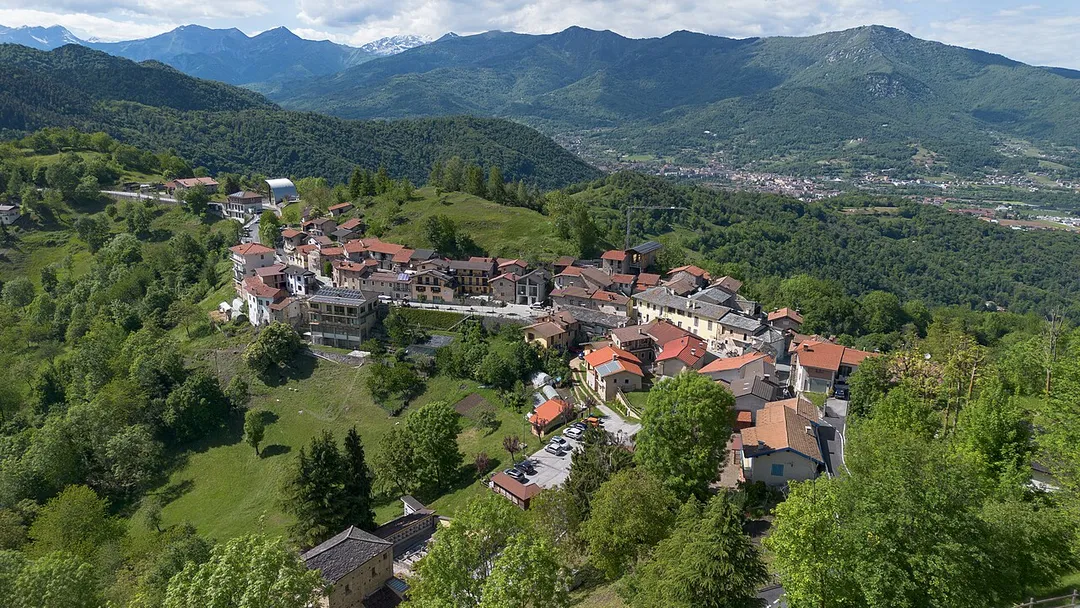 Aerial view of Montemale di Cuneo with Dronero in the background (Province of Cuneo, Piedmont, Italy)