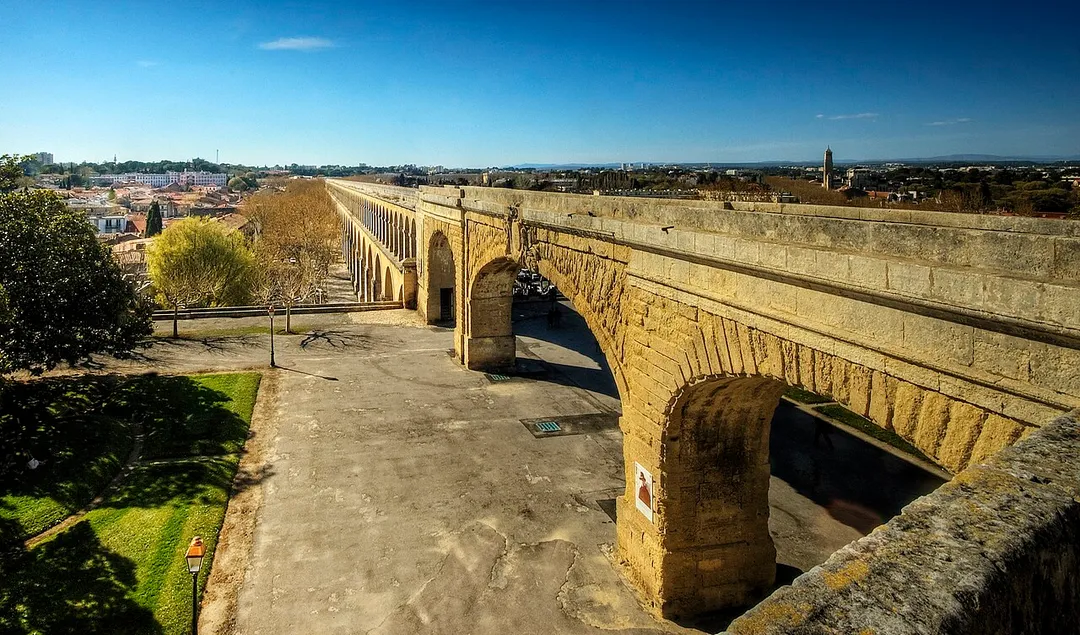 The ancient Romans constructed numerous aqueducts  to supply water to cities and industrial sites. These aqueducts were amongst the greatest engineering feats of the ancient world, and set a standard not equalled for over a thousand years after the fall of Rome. Many cities, such as Segovia, still maintain and use the ancient aqueducts for their water supply even today. 
The Romans typically built numerous aqueducts to serve any large city in their empire, as well as many small towns and industrial sites. The city of Rome itself, being the largest city, had the largest concentration of aqueducts, with water being supplied by eleven aqueducts constructed over a period of 500 years. They served potable water and supplied the numerous baths and fountains in the city, as well as finally being emptied into the sewers, where they performed their last function in removing waste matter. The methods of construction are well described by Vitruvius in his work De Architectura written in the first century BC. His book would have been of great assistance to Frontinus, a general who was appointed in the late first century AD to administer the many aqueducts of Rome. He discovered a discrepancy between the intake and supply of water caused by illegal pipes inserted into the channels to divert the water, and reported on his efforts to improve and regulate the system to the emperor Nerva at the end of the first century AD. The report of his investigation is known as De aquaeductu.
In addition to masonry aqueducts, the Romans built many more leats; channels excavated in the ground, usually with a clay lining. They could serve industrial sites such as gold mines, lead and tin mines, forges, water-mills and baths or thermae. Leats were very much cheaper than the masonry design, but all aqueducts required good surveying to ensure a regular and smooth flow of water.

From Wikipedia, the free encyclopedia
