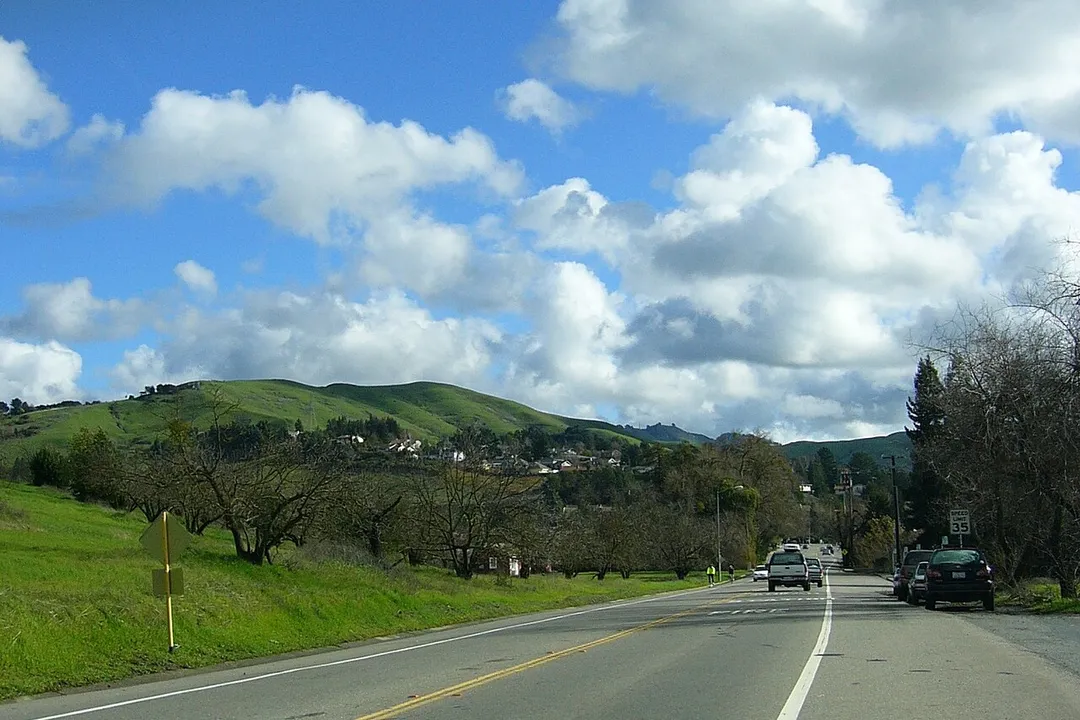 Intersection of Camino Ricardo and Moraga Way, looking east toward Moraga Road.  The fire station is on the right and the old pear orchard is on the left.