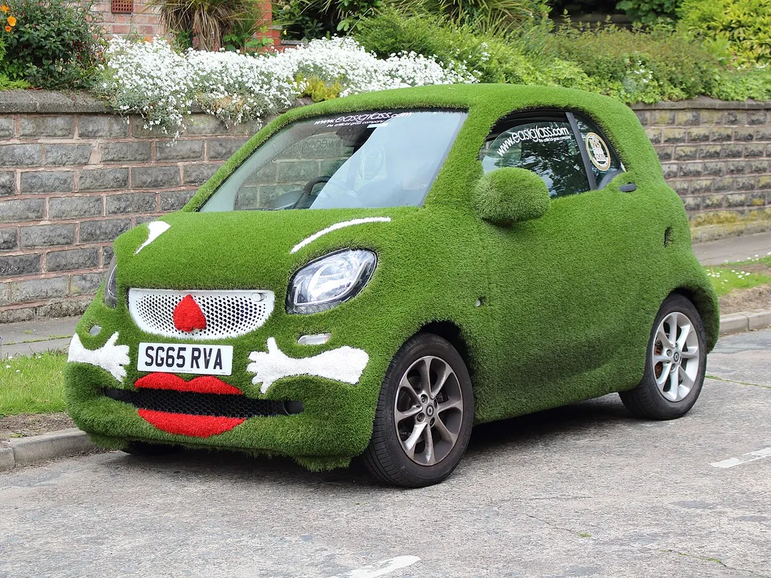 A promotional Smart car, covered in artificial grass, in Mossley Hill, Liverpool.