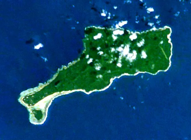 Astronaut photo of Mota Lava island, in the Banks Islands, Vanuatu. North at top. Cropped from Image:ESC large ISS006 ISS006-E-26739.JPG, rotated, colour rebalanced. (If these manipulations give me any copyright in the transformed image, I release it to the public domain.)
Original image metadata follows:

Mission: ISS006 Roll: E Frame: 26739 Mission ID on the Film or image: ISS006
Country or Geographic Name: VANUATU
Features: BANKS ISLANDS, MOTA, SADDLE I.
Center Point Latitude: -14.0 Center Point Longitude: 167.5 (Negative numbers indicate south for latitude and west for longitude)
Date: 20030210 (YYYYMMDD)GMT Time: 222701 (HHMMSS)
Nadir Point Latitude: -14.1, Longitude: 165.5 (Negative numbers indicate south for latitude and west for longitude)
Nadir to Photo Center Direction: East
Sun Azimuth: 96 (Clockwise angle in degrees from north to the sun measured at the nadir point)
Spacecraft Altitude: 211 nautical miles (391 km)
Sun Elevation Angle: 50 (Angle in degrees between the horizon and the sun, measured at the nadir point)
Orbit Number: 130