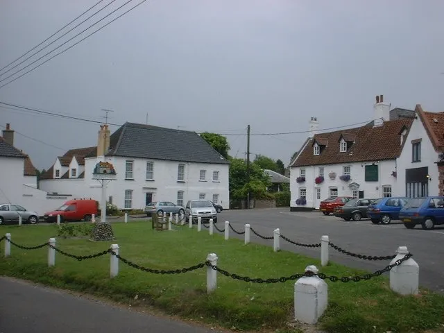 The Crown Hotel, Mundford Also visible is the traditional village sign common to Norfolk and Suffolk villages. Mundford's was recently replaced by a new design chosen from a competition for local people and organisations.