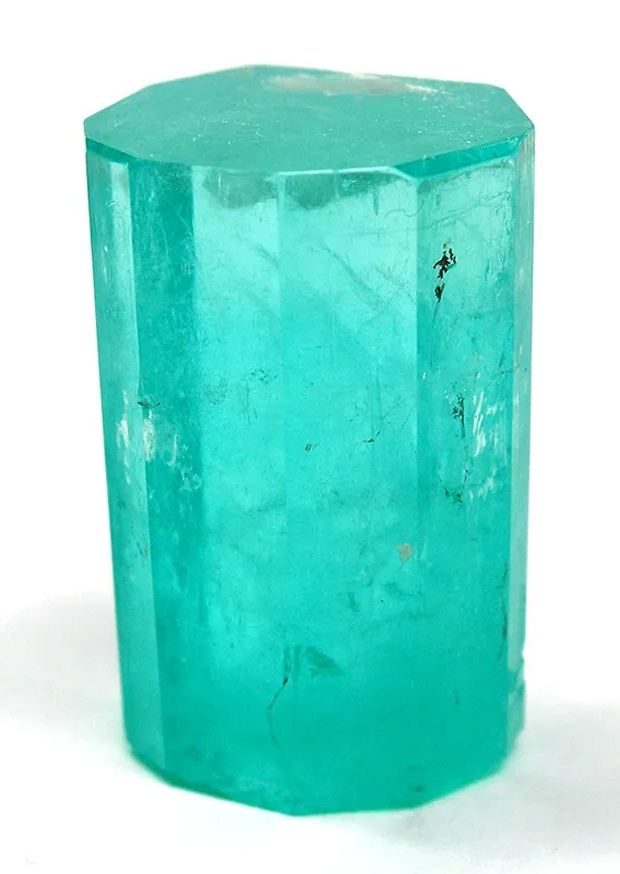Beryl
Locality: Chivor Mine, Chivor, Guavió-Guatéque Mining District, Boyacá Department, Colombia (Locality at mindat.org)
Size: miniature, Large Thumbnail
Emerald (12-SIDED)
A simply stunning, fat thumbnail-sized crystal of emerald with very good COLOR , LUSTRE , and GEMMINESS...in person, much better than you can relate from the pics. The termination is glassy. The upper half is quite gemmy and mostly transparent, whereas it grades to opacity towards the base. This has some intrinsic facet rough value in the top portion although it is admittedly included in parts by internal veiling; but this is ironically of benefit to the specimen collector because its still very appealing as a specimen crystal and yet it survived the cutter because of slight flaws that do not matter as much in a specimen as in the cut stone. Also, if it were of the highest cutting grade, it would be unaffordable to the specimen collector - so one looks for the compromise between top quality and visual appeal in buying an emerald crystal, always aiming to have SOME intrinsic cutting value. Note that the piece is MUCH more gemmy in person because the camera cannot focus well on the crystal without going through to the back faces. You can actually see if you look closely how the faces you se ein the leftmost pic "in front" are actuyally the rear bevels showing through the completely gemmy upper portion of the crystal! BY THE WAY AS AN ADDED BIT OF INTEREST FROM THE FORMER OWNER: My Emerald is from the Chivor Mine. One of the key clues on this is the fact that the Emerald is 12 sided or Di-hexagonal. The Chivor is well known for this phenomenon. Niether Muzo or Cosquez produce these 12 sided xtls that I am aware of.