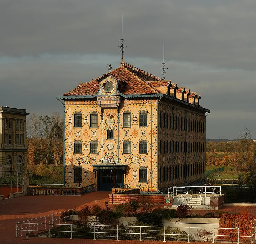 Saulnier Watermill, in the Menier chocolate factory, Noisiel, France. Built in 1872, it was the first building in the world with a visible metallic structure and is also characterized by its ceramic tiles patterns. The three years above the entrance correspond respectively to the year the old mill was built (1157), the year the Menier factory was moved to Noisiel (1825) and to the year the Saulnier Mill replaced the old one. The Menier chocolate factory is now headquarters of Nestlé France. This picture is a mosaic of 6 photos (2x3) taken with a Canon EOS 400D+EF 100mm f/2.8 Macro at 100mm, f/8.0, 1/800 sec and ISO 200. Stitching was done with Hugin and Enblend.