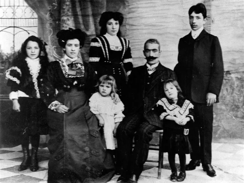 Portrait of the Gazarian family in Boston, 1908. (Left to Right)-Alice, Azniv, Gladys (small child), Lucy, Toros, Olga, and Ted Ghazarian. Ted was the first Armenina graduate at MIT.