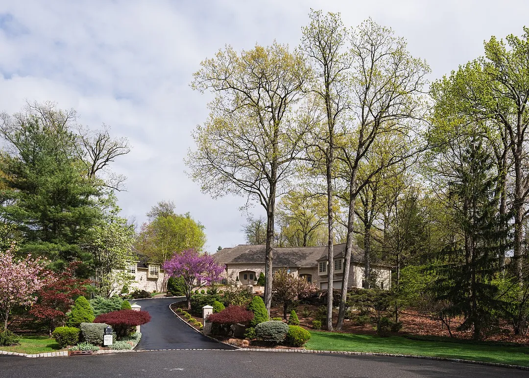 House in North Caldwell whose exterior was used as the Soprano family residence in the HBO series The Sopranos (1999-2007), seen from the road with its long driveway and spring landscaping. New Jersey.