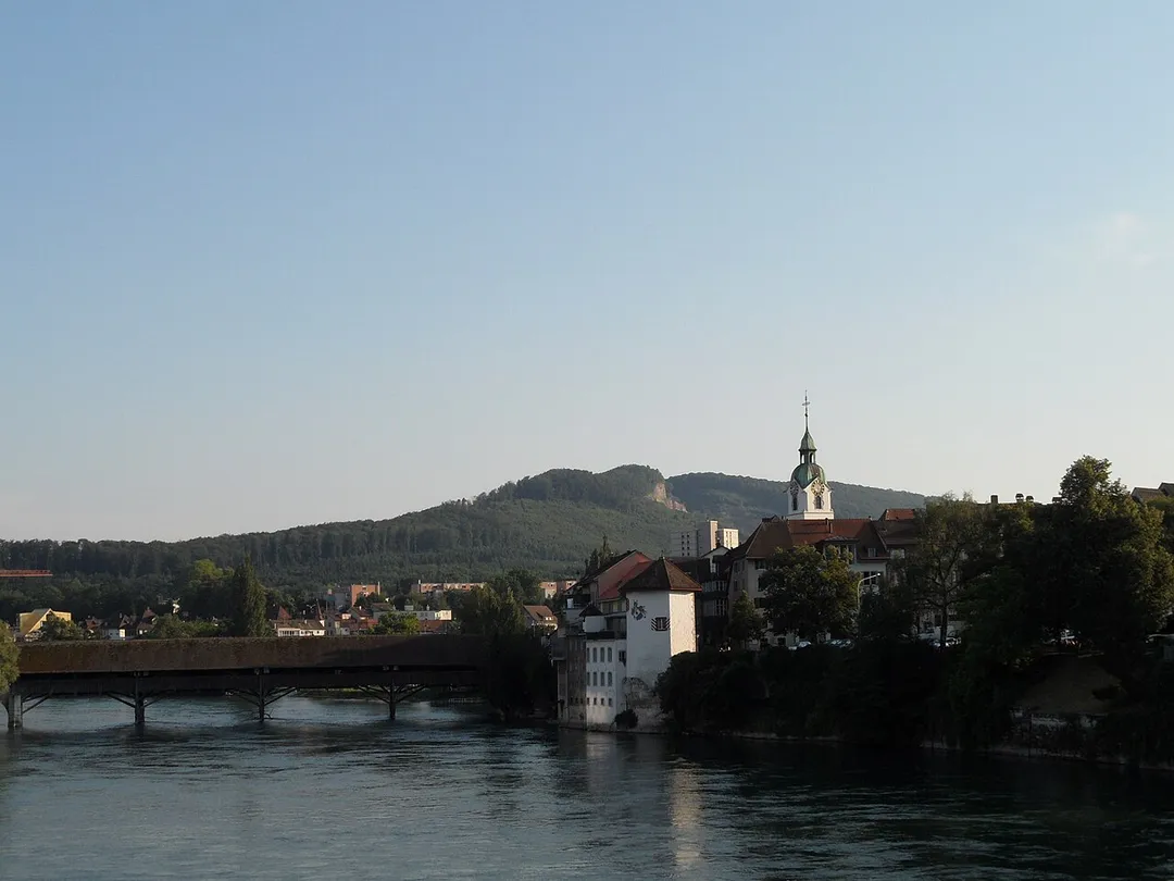 Old city of Olten, canton of Solothurn, Switzerland, with wooden bridge crossing the river Aare, and Stadtturm (city tower).