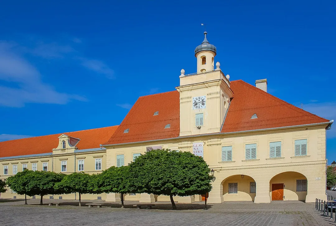 Right and centre: the former City Guard Building, now Osijek Archaeological Museum. Left: part of the Franjo Kuhač Music School.