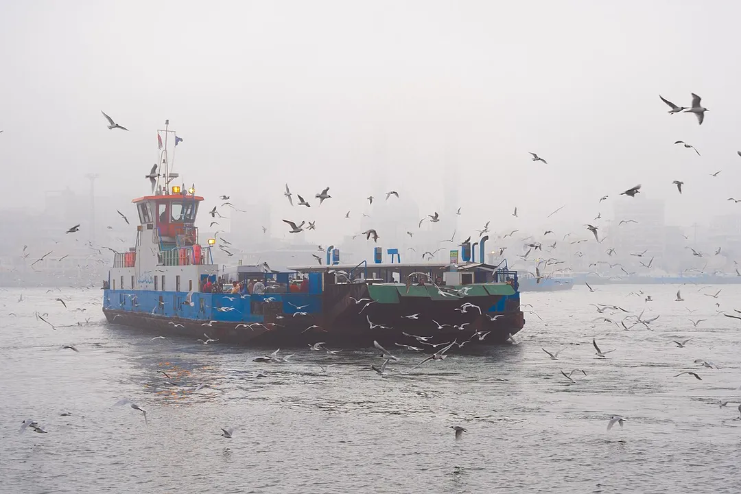A ferryboat in the fog that transports passengers to the eastern side of the Suez Canal, where the city of Port Fouad is located.. and it does not appear as it disappeared because of the thick fog
