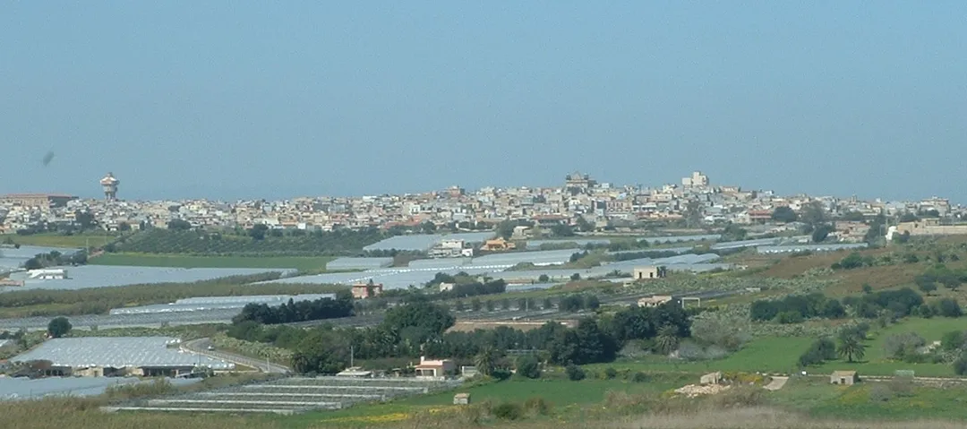 Pachino (SR), View of town with greenhouses in front.