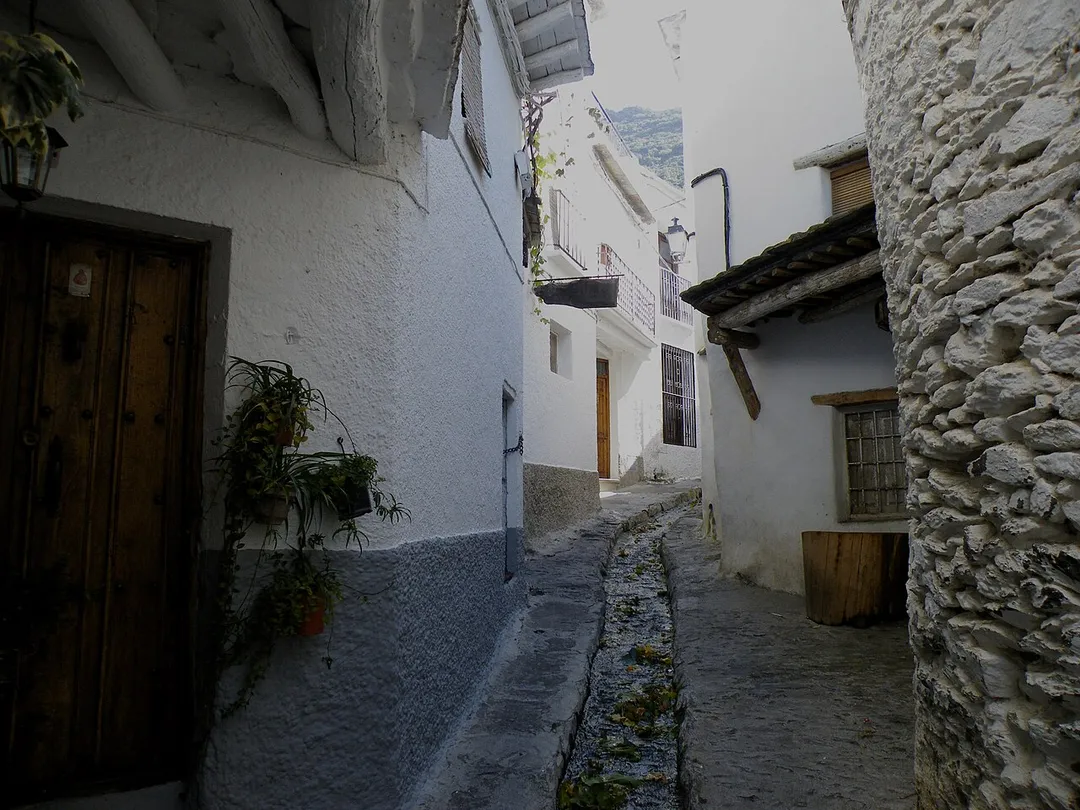Small water canal in the street, Pampaneira, Spain.