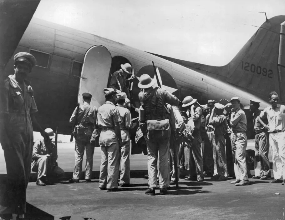 Joint U.S.-Brazilian Air Base in South AmericaFighter pilots of the U.S. Army Air Forces arriving from the United States disembark from a transport at a huge U.S.-Brazilian air base in Brazil, operated jointly by the two countries to service and control the traffic of thousands of transports and bombers which stop there on journeys between the U.S. and the fighting fronts of the world. After a brief rest, the pilots took off again for a war zone overseas.12247-FIANot for use in western hemisphere or British isles.