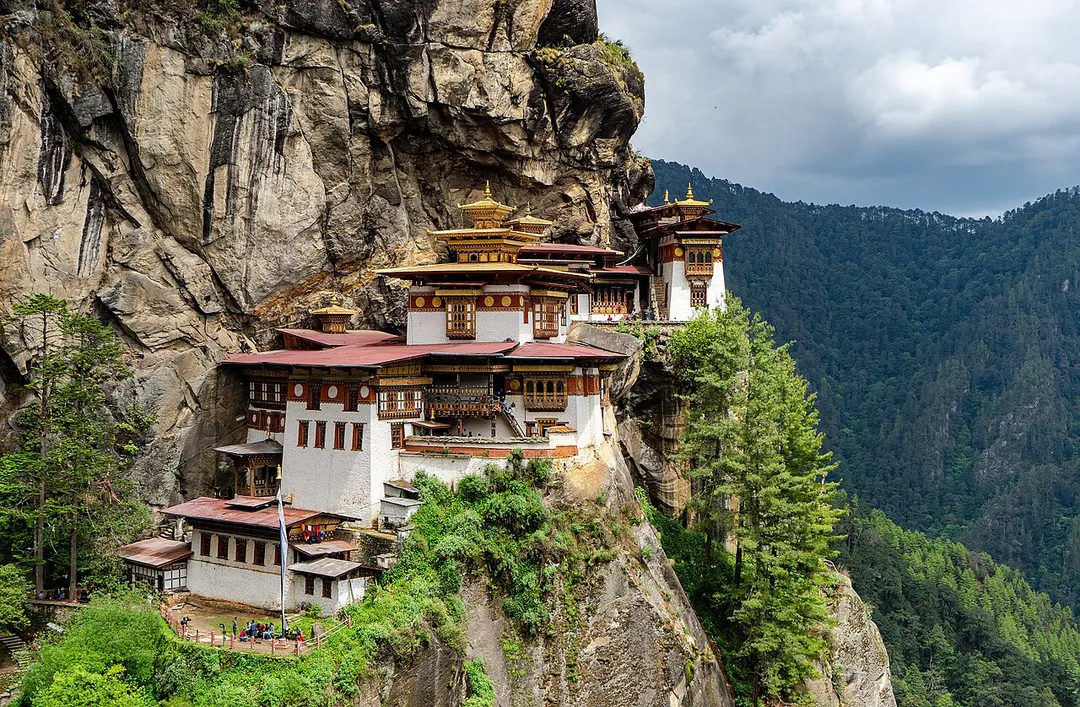 Paro Taktsang monastery in the upper Paro valley of Bhutan. Also known as the Taktsang Palphug Monastery and the Tiger's Nest, it is located in the cliffside of a mountain, around a cave where Guru Padmasambhava meditated and practiced Vajrayana Buddhism in the early 9th century. It was built in 1692 by 4th Druk Desi Tenzin Rabgey.