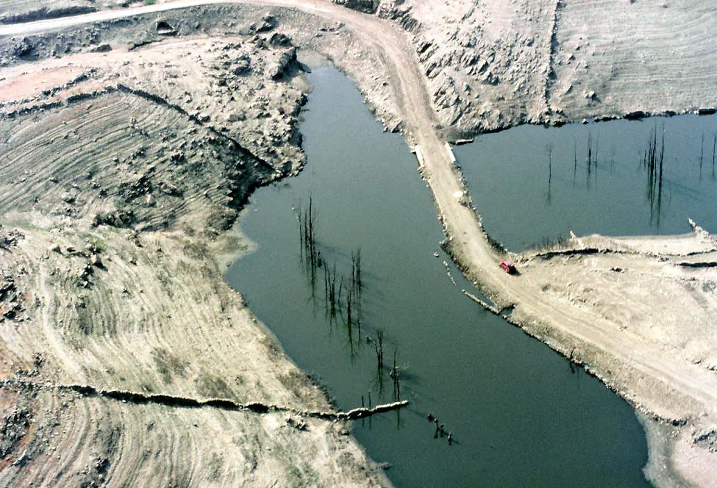 Aerial view of Pedrezuela Reservoir with a very low level of water. Pedrezuela, Madrid, Spain