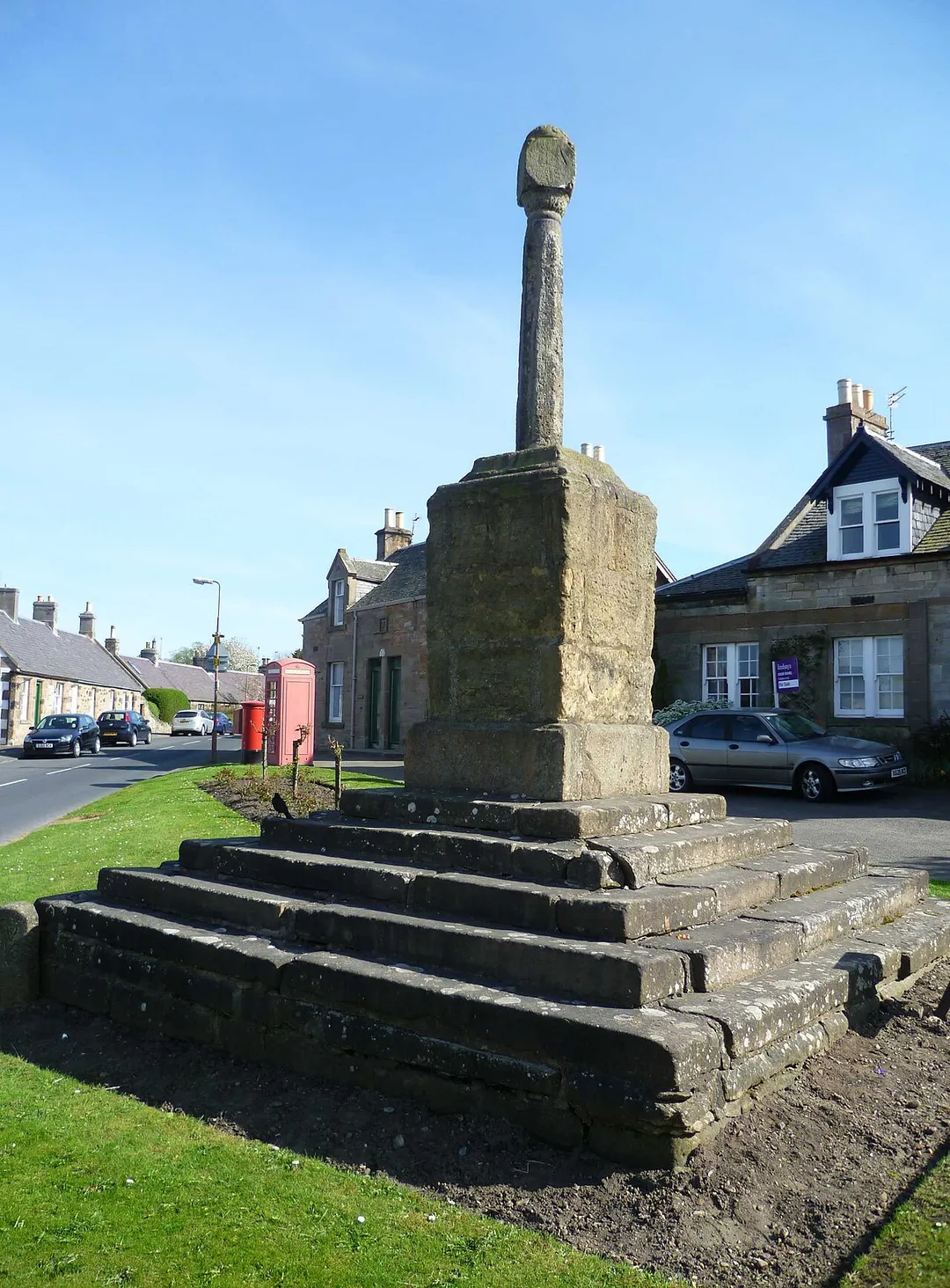 A mercat cross signifying a burgh of barony, i.e. burgh  status granted by the local lord, including the right to hold a weekly market.
