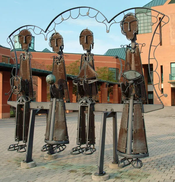 Sculpture by Andreas Drenters of the "Pickering Pioneer Family" sits by city hall in Esplanade Park