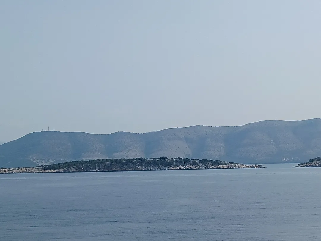 Photograph of Chironisi Isle which is the nothernmost of the Syvota Islands and next to the Bay of Plataria in the Thesprotia