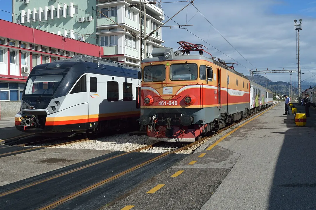 Balkans Rail Trip, Autumn 2013 - Day Nine

New and old trains side by side at Podgorica. Seen at the Montenegrin capital station, Podgorica are examples of how the railway is set to change. On the left EMU 6111.101 is working train 7103, 08:40 Nikšić to Bar. To the right is part of the fleet of former Yugolslavian Railways now in ŽCG livery. Running in an hour late, train 6101, 06:30 Bijelo Polje to Podgorica hauled by 461.040 is seen beside. Date taken 1 October 2013.