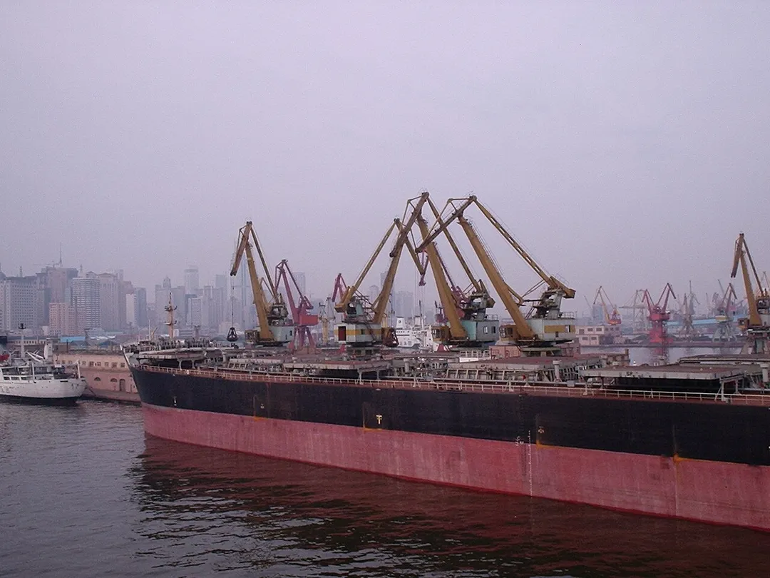 Dalian is the main port for North East China, and is the 3rd largest port in the whole of China. Here you can see a number of the harbour crains in action and behind them the skyline of Dalian proper.