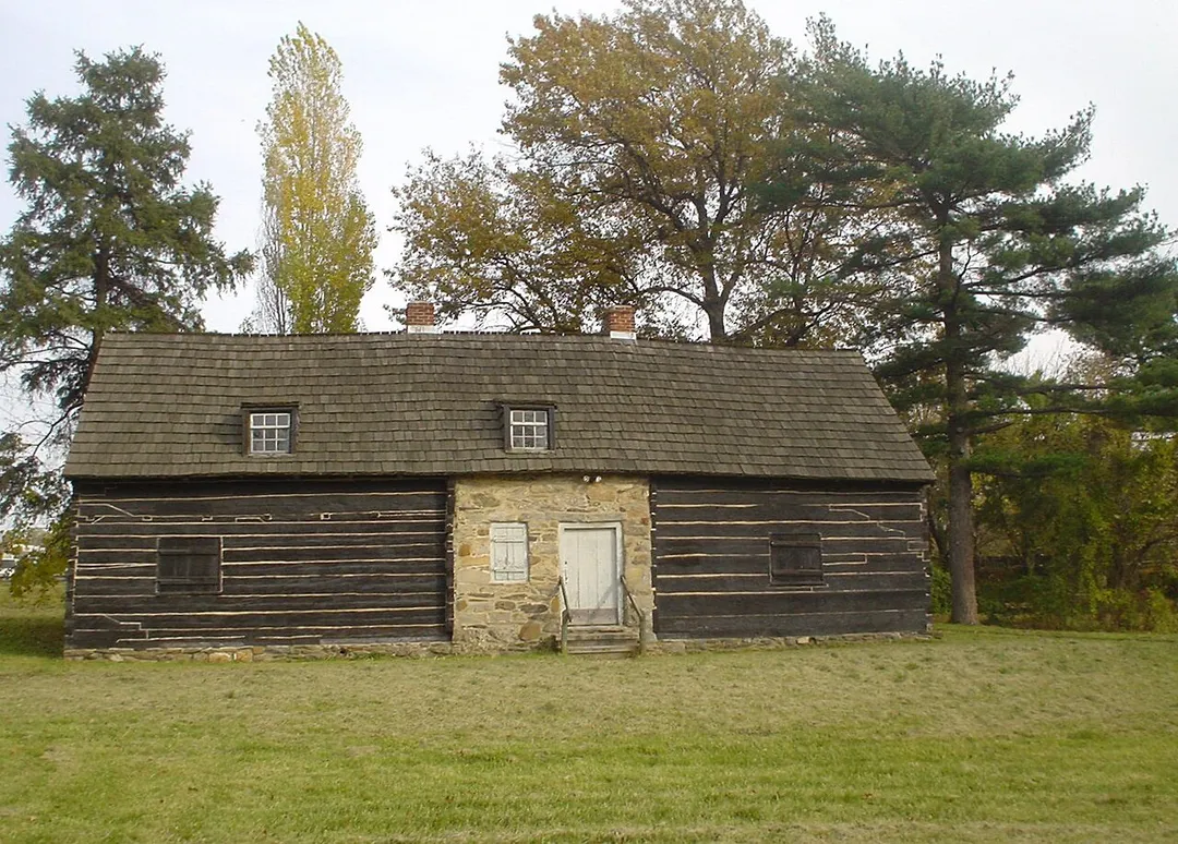 Morton Mortonsen Cabin.  On NRHP.  2 separate cabins - the rhs built maybe 1698, the lhs long before (after 1653), then joined by stone walls and re-reoofed.
