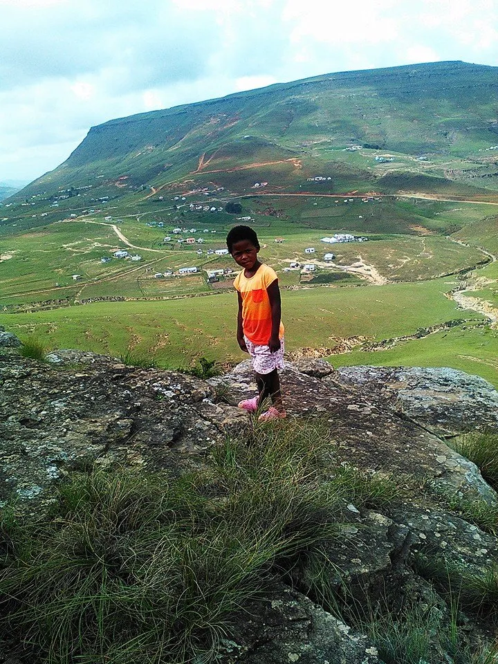 Photograph of KwaNdoyi, Qumbu, with a local child in the foreground.