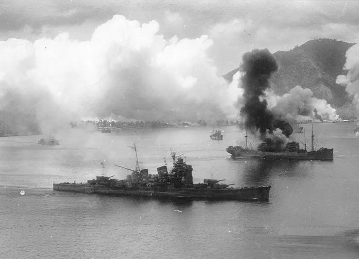 Aircraft of the USAAF 3rd Bomb Group attack Japanese ships in Simpson Harbor, 2 November 1943.
The heavy cruiser Haguro is in the foreground. She had been somewhat damaged during the battle of Empress Augusta Bay the previous night. The burning transport at right appears to be one of the Hakone Maru class, of which Hakone Maru, Hakozaki Maru and Hakusan Maru were still afloat at the time. The ship in the left distance, partially hidden by smoke, appears to be the submarine tender Chogei or Jingei.