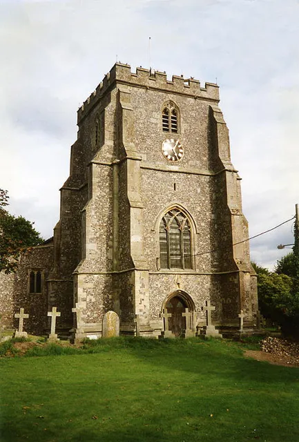 Church of the Holy Cross, Ramsbury, UK. "A rather solid, squat tower built with flint; inside the church are the remains of a Saxon cross. There was a bishopric here in the 10th century which was merged with the see of Sherborne in 1058, so the site the church stands on is probably an ancient and significant one"