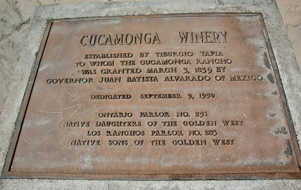 The original Cucamonga Rancho dates 1839 when the Mexico’s acting Governor Juan Batista Alvarado granted approximately 13,000 acres of land to Don Tiburcio Tapia of Los Angeles. A small vineyard consisting of twelve rows of forty-seven vines each (most likely of the Mission variety), was planted by Jose’ Maria Valdez, Tapia’s foreman and caretaker. The winery was built from adobe. Designated as “the first commercial winery in California” and included as CA State Landmark No. 490, it is located on Historic Route 66 - Foothill Blvd and Vineyard Avenue.